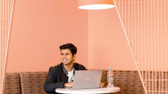 Portrait of Saurabh at an India roadshow Saurabh Kaura working on his laptop during an India roadshow event