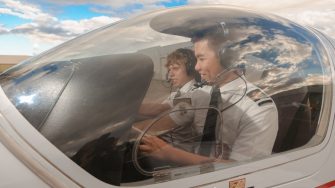 Two Male Students Flying Plane Two Male Students Flying Plane