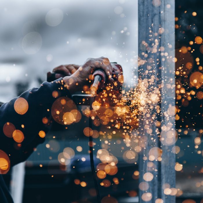 Sparks Person holding tool during daytime