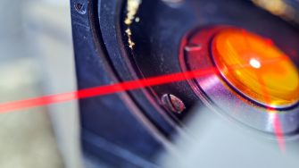 red laser in laboratory Red laser on optical table in physics laboratory